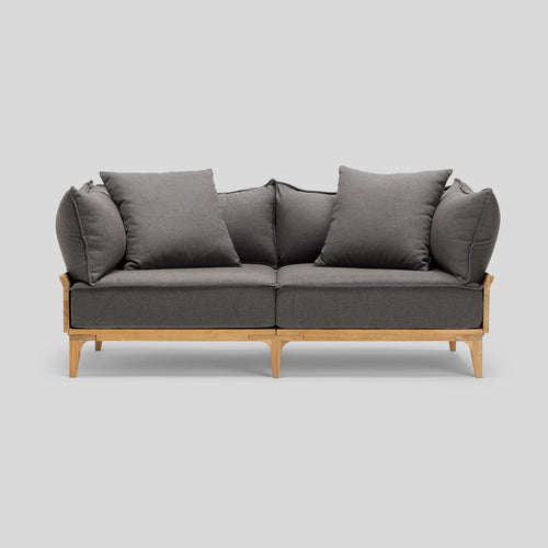 A studio photo of Bluff Loveseat Sunbrella Graphite