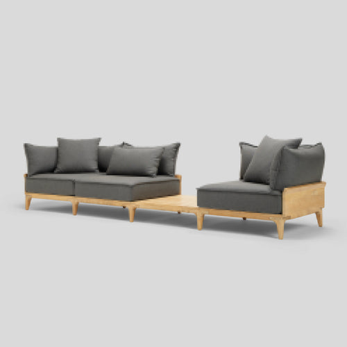 A studio photo of Bluff Sofa with In-line Table Sunbrella Graphite