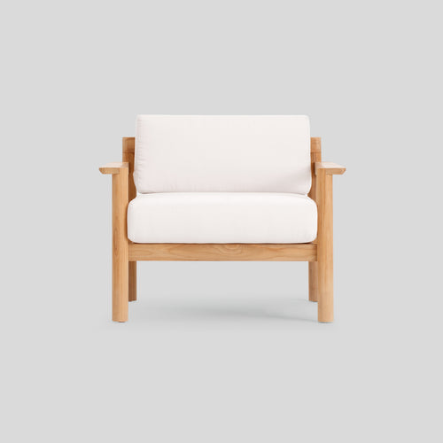 A studio photo of Haven Chair Sunbrella Canvas / Teak Armrest