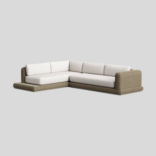 A studio photo of Roundabout Sectional with Side Table Natural | Sunbrella White