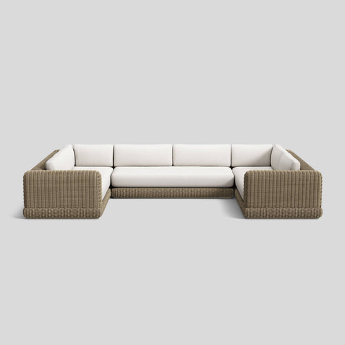 A studio photo of Roundabout Sectional Natural | Sunbrella White / Three Piece U-Shape - Seats 8