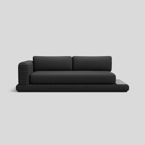 A studio photo of Roundabout Sofa with Side Table Charcoal | Sunbrella Char