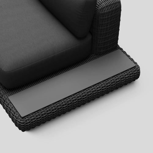 A studio photo of Roundabout Sofa with Side Table Charcoal | Sunbrella Char