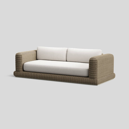 A studio photo of Roundabout Sofa Natural | Sunbrella White