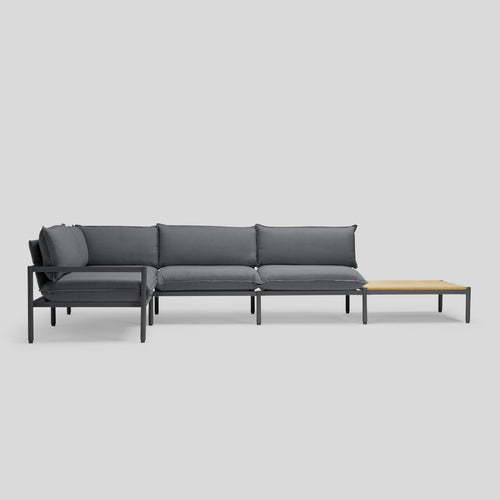 A studio photo of Terra Sectional with End Table Charcoal / Four Piece with In-line End Table / Table