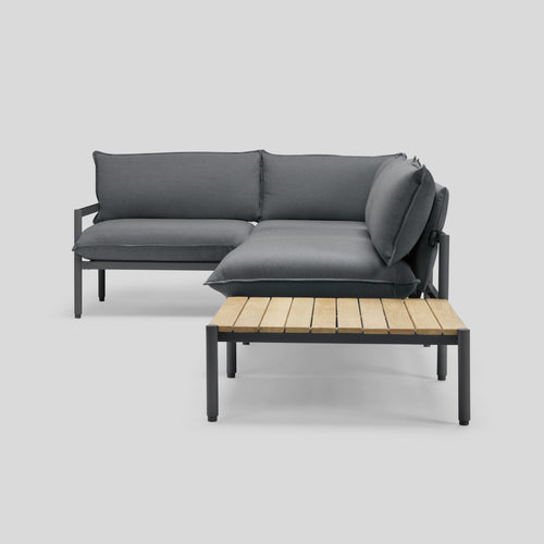 A studio photo of Terra Sectional with End Table Charcoal / Four Piece with In-line End Table / Table