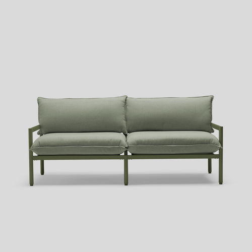 A studio photo of Terra Loveseat Olive