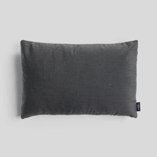 A studio photo of Terra Throw Pillow Sunbrella Charcoal / 24 x 16