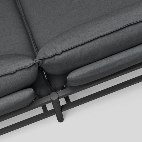 A studio photo of Terra Sofa with In-line Table Charcoal / Table