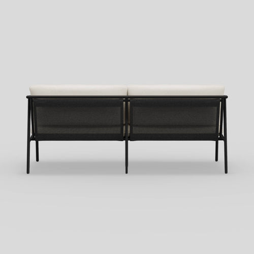 A studio photo of Trase Sofa Charcoal | Sunbrella Cloud