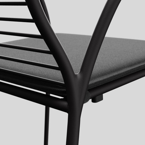 A studio photo of XY Dining Chair (Set of 2) Charcoal / Arm