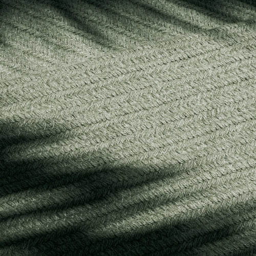 A studio photo of Braid Rug Basil / 5' x 8'