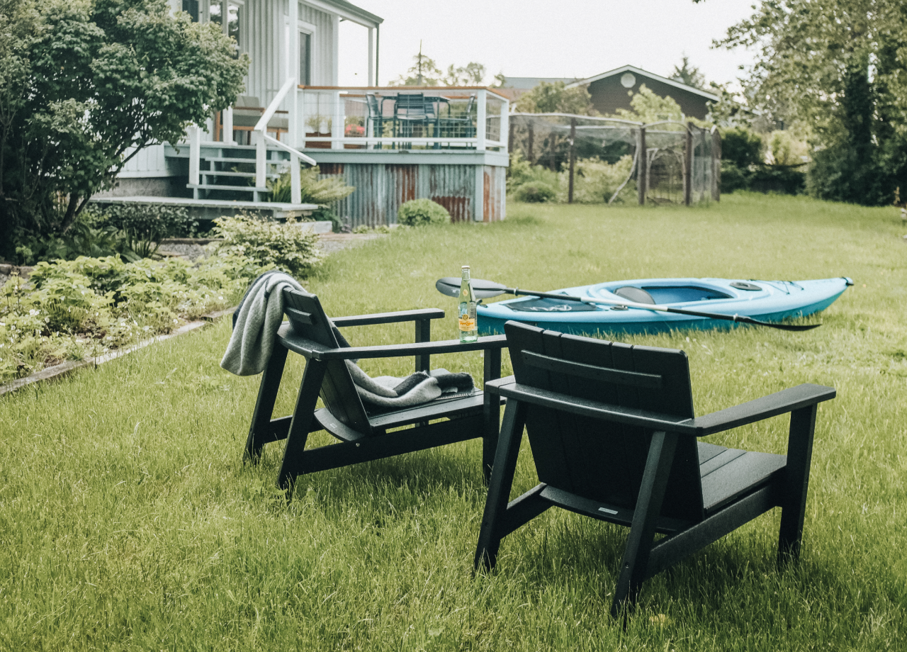 2 adirondack chairs on grass