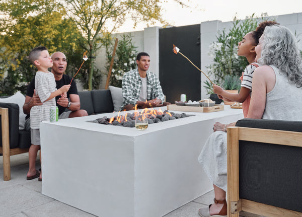 People gathered around a fire table