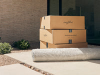 Packaged Neighbor product on a customer doorstep