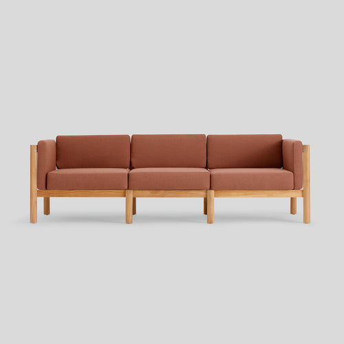 A studio photo of Haven Sofa Sunbrella Rust / Cushion Arm