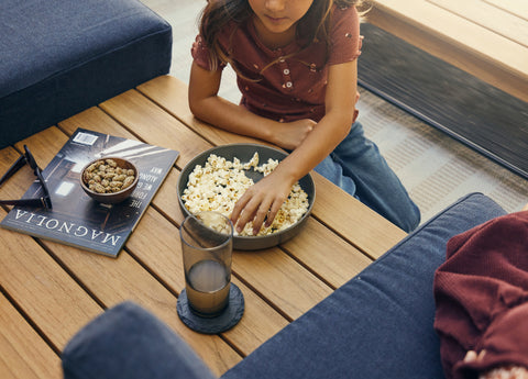 Teak table attached to outdoor sectional sofa