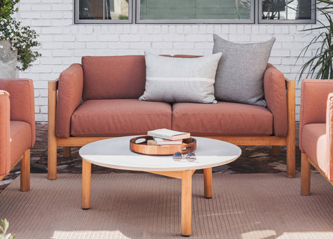 Rust-colored outdoor loveseat
