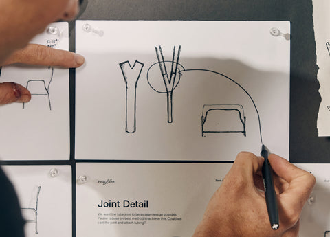 Designer sketching notes for chair design