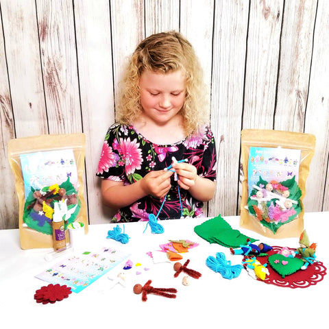 Little girl Making bendy doll fairies.