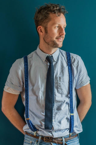 Writer wearing Blue Suspenders and Tie