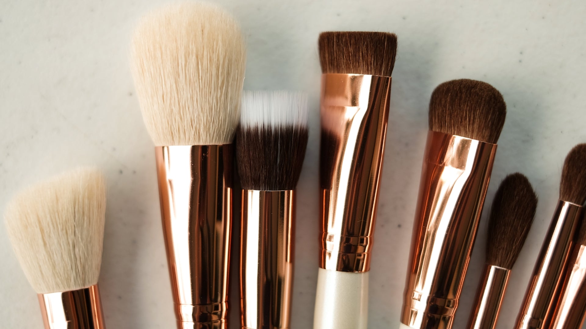 Close up of different sized beauty brushes