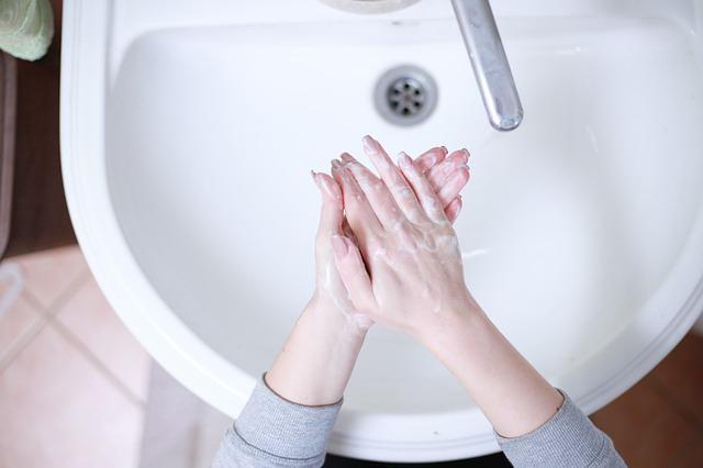 Cleaning Hands with Hand Sanitiser