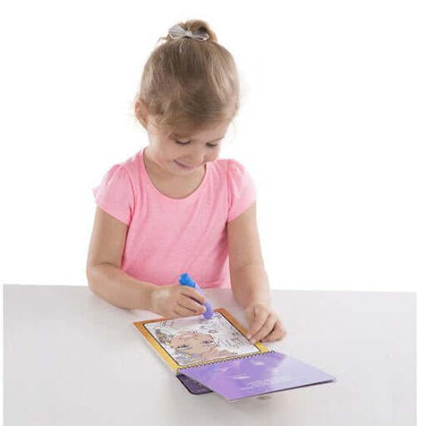 little girl playing with melissa and doug wipe clean toys for vacation 