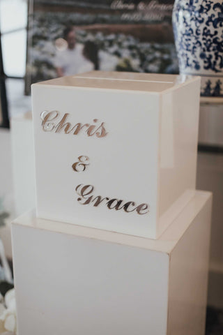 bridal boxes with the names chris and grace on them