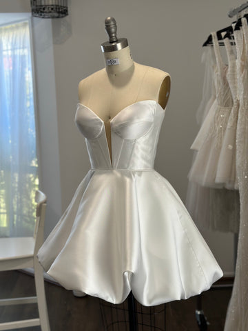 bridal mini corset dress with bubble hem on dress form