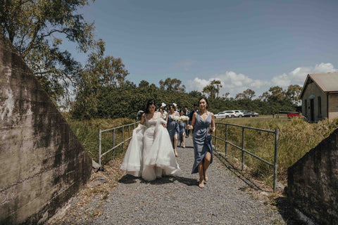 bridal party walking to their wedding photoshoot location