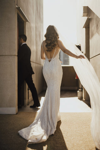 bride and groom walking into doorway