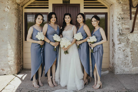 bride and her bridesmaids on the wedding day taking photos