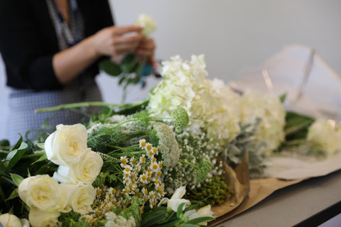 florist making bridal bouquets