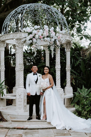 husband and wife posing for photos on their wedding day