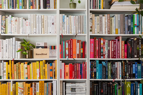 shelf full of books in all colours
