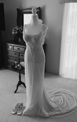 wedding dress on dressform in bedroom