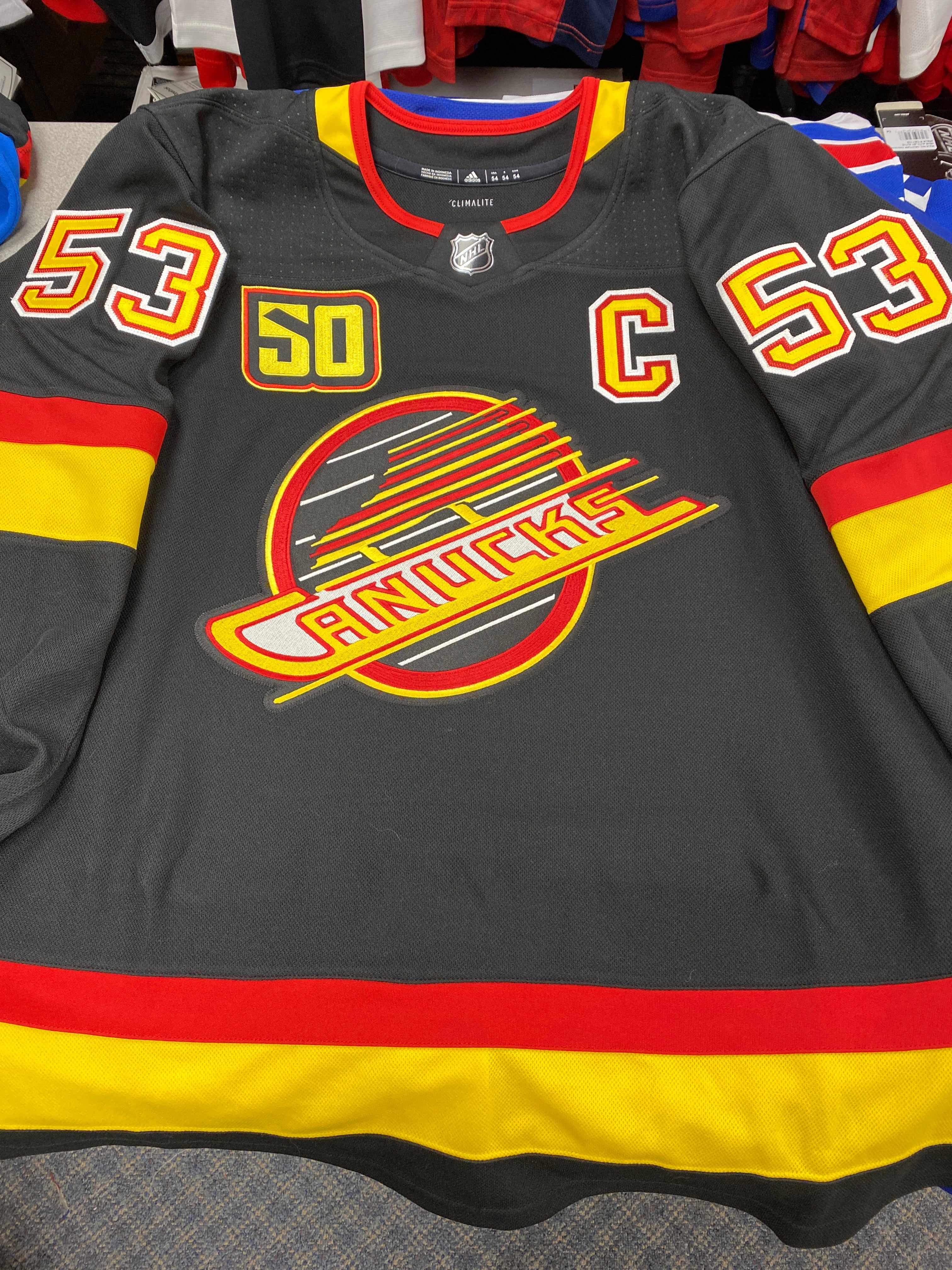 canucks red skate jersey