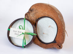 Coconut candles in husk and bowl