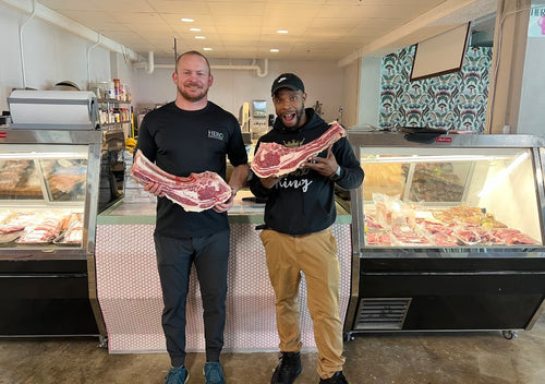Image of two employees at the HERO BoVino Butcher & Deli 