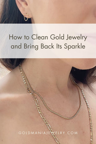 Two gold jewelry chains gracefully adorning a woman's neck, radiating a subtle charm