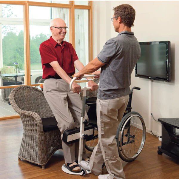 man with limited mobility getting assistance to stand