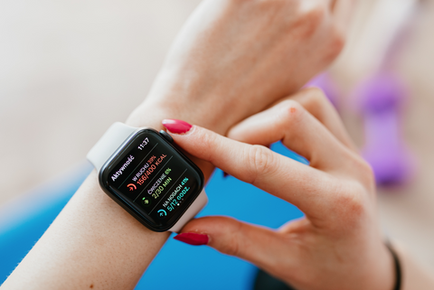 Woman checking smartwatch