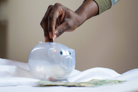 Saving money with piggy bank