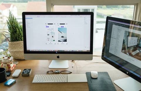 Office desk with computer, keyboard and mouse