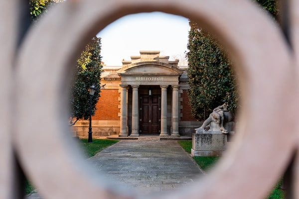 A facade of old building with stone columns