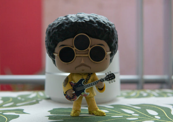 A figurine of a person playing guitar