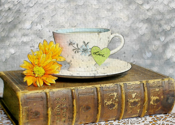 A photo of a cup tea relaxing on an old vintage book