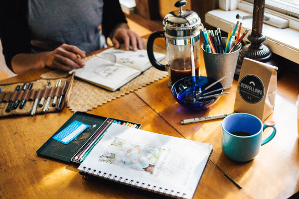 A photo of a person looking through a sketch book