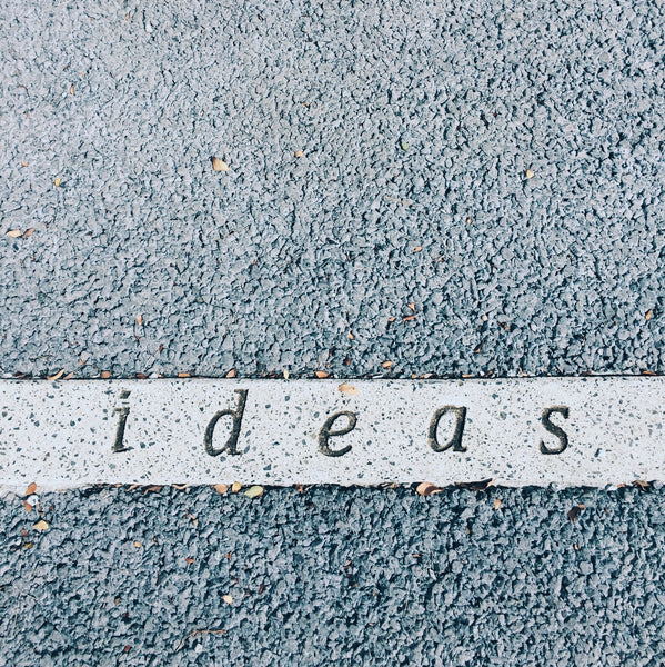 A photo showing ideas carved on concrete surface